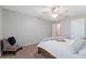 Airy bedroom showcasing a comfy bed, a stylish accent chair, and calming decor at 4608 Egg Harbor Dr, Kissimmee, FL 34746