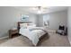 Bright bedroom showcasing a comfortable bed, side table, stylish chair, and natural light filtering through the window at 4608 Egg Harbor Dr, Kissimmee, FL 34746