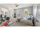 Bedroom featuring a bed, a desk, and a view into the bathroom at 4608 Egg Harbor Dr, Kissimmee, FL 34746