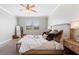 Bright bedroom with large windows, soft carpet, a bed with stylish pillows, and modern decor touches at 4608 Egg Harbor Dr, Kissimmee, FL 34746