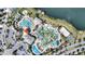 Aerial view of the community amenities including pools, lazy river, mini golf, splash pad and lake access at 4608 Egg Harbor Dr, Kissimmee, FL 34746