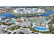 Aerial view of the community amenities including pools, lazy river, mini golf, splash pad and lake access at 4608 Egg Harbor Dr, Kissimmee, FL 34746