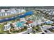 Aerial view of the community amenities including pools, lazy river, mini golf, splash pad and lake access at 4608 Egg Harbor Dr, Kissimmee, FL 34746