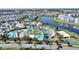 Aerial view of the community amenities including pools, lazy river, mini golf, splash pad and lake access at 4608 Egg Harbor Dr, Kissimmee, FL 34746