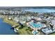 Aerial view of the community amenities including pools, lazy river, mini golf, splash pad and lake access at 4608 Egg Harbor Dr, Kissimmee, FL 34746