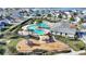 Aerial view of community pool, playground, and clubhouse; perfect for Gathering fun at 4608 Egg Harbor Dr, Kissimmee, FL 34746