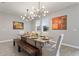 Elegant dining room features modern lighting, stylish decor, and a wooden dining table with seating for six at 4608 Egg Harbor Dr, Kissimmee, FL 34746