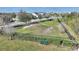 Picture of community dog park surrounded by fence with trees, shrubs, a bench, and a slide at 4608 Egg Harbor Dr, Kissimmee, FL 34746