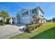Well-maintained two-story home with a three-car garage and lush landscaping at 4608 Egg Harbor Dr, Kissimmee, FL 34746