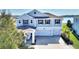 Beautiful two-story home with a three-car garage and well-manicured landscaping at 4608 Egg Harbor Dr, Kissimmee, FL 34746