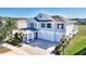 Charming two-story home with a three-car garage and professionally landscaped yard at 4608 Egg Harbor Dr, Kissimmee, FL 34746