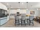 Modern kitchen with white cabinets, stainless steel appliances, granite countertops, and a stylish breakfast bar at 4608 Egg Harbor Dr, Kissimmee, FL 34746