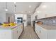 Spacious kitchen features granite counters, stainless steel appliances, gray tile backsplash and hardwood floors at 4608 Egg Harbor Dr, Kissimmee, FL 34746