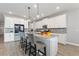 Bright kitchen with granite countertops, stainless steel appliances, pendant lighting, and center island with barstool seating at 4608 Egg Harbor Dr, Kissimmee, FL 34746