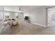 Bright and spacious carpeted living room with white couches and plenty of natural light from the windows at 4608 Egg Harbor Dr, Kissimmee, FL 34746