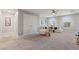 Spacious carpeted living room featuring a white couch, glass table, and modern decor at 4608 Egg Harbor Dr, Kissimmee, FL 34746