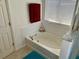 Bathroom with a tiled bathtub, a shower, and clean features, offering a relaxing space at 525 Aster Dr, Davenport, FL 33897