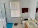 Clean bathroom featuring a walk-in shower, a toilet, and neutral-toned countertops at 525 Aster Dr, Davenport, FL 33897