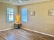 Cozy bedroom with laminate flooring, neutral walls, and a window at 525 Aster Dr, Davenport, FL 33897