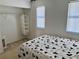 Simple bedroom featuring a closet and a bed, offering a neat and organized space at 525 Aster Dr, Davenport, FL 33897