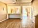 Inviting dining area with laminate flooring, open to kitchen, and neutral decor at 525 Aster Dr, Davenport, FL 33897