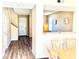 Inviting view of dining area featuring modern laminate floors and neutral decor at 525 Aster Dr, Davenport, FL 33897