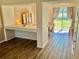 Inviting view of dining area featuring view to backyard with modern laminate floors and neutral decor at 525 Aster Dr, Davenport, FL 33897