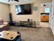 Cozy living room with TV, stylish decor, and comfortable seating, creating a welcoming atmosphere at 525 Aster Dr, Davenport, FL 33897