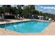Enjoy the community pool with plenty of room to swim and lounge under the sunny sky at 525 Aster Dr, Davenport, FL 33897