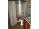 Cozy bathroom features a shower and tub combination with neutral color scheme at 5610 Forest Ridge Dr, Winter Haven, FL 33881