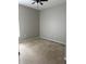 A cozy bedroom with carpeted flooring, ceiling fan, neutral wall color, and natural light at 5610 Forest Ridge Dr, Winter Haven, FL 33881