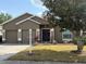 Charming home with a well-manicured lawn, two car garage and inviting front entrance at 5610 Forest Ridge Dr, Winter Haven, FL 33881