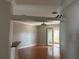 View of living room with sliding glass doors leading to lanai with hardwood floors at 5610 Forest Ridge Dr, Winter Haven, FL 33881