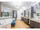 Luxurious bathroom with double vanity, soaking tub, and walk-in shower at 6001 Caymus Loop, Windermere, FL 34786