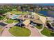 Aerial view of community clubhouse with pool, tennis courts, and other amenities at 6001 Caymus Loop, Windermere, FL 34786
