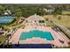Resort-style community pool with surrounding lounge area at 6001 Caymus Loop, Windermere, FL 34786