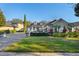 House with a golf cart and manicured lawn at 6001 Caymus Loop, Windermere, FL 34786