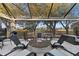 Enjoy the view from this covered patio fire pit at 6001 Caymus Loop, Windermere, FL 34786