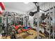 Well-equipped home gym featuring various exercise machines and mirrors at 6001 Caymus Loop, Windermere, FL 34786