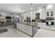 Modern kitchen with large island, stainless steel appliances, and granite countertops at 6001 Caymus Loop, Windermere, FL 34786
