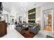 Spacious living area with a unique wall feature and access to other rooms at 6001 Caymus Loop, Windermere, FL 34786