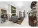 Elegant living room featuring a built-in bar and comfortable seating at 6001 Caymus Loop, Windermere, FL 34786