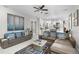 Open living room showcasing a spacious layout, neutral color palette, and ample natural light at 6001 Caymus Loop, Windermere, FL 34786