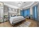 Spacious main bedroom with luxurious bedding and ample natural light at 6001 Caymus Loop, Windermere, FL 34786
