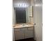 Bathroom with vanity, mirror, and light fixture at 6088 Westgate Dr # 103, Orlando, FL 32835