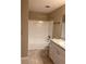 Clean bathroom with tiled floors, shower and tub, and vanity at 6088 Westgate Dr # 103, Orlando, FL 32835