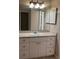 Bathroom vanity with ample storage and modern lighting at 6088 Westgate Dr # 103, Orlando, FL 32835