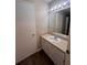Clean bathroom with single sink vanity and a bathtub at 6088 Westgate Dr # 103, Orlando, FL 32835