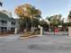 Gated entrance to the community with a stop sign at 6088 Westgate Dr # 103, Orlando, FL 32835