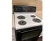White electric cooktop with four burners at 6088 Westgate Dr # 103, Orlando, FL 32835